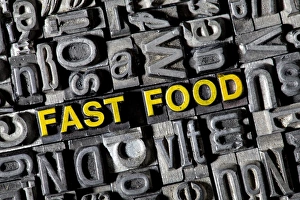 Old lead letters forming the word fast food Old lead letters forming the word fast food
