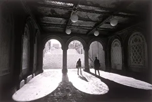 People walking underneath terrace in Central Park People walking underneath terrace in Central Park