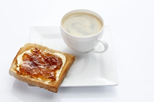 Porcelain plate with a cup of coffee and toast with apricot jam Porcelain plate with a cup of coffee and toast with apricot jam
