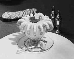 Prawns with savoury sauce in crushed ice bowl, close-up Prawns with savoury sauce in crushed ice bowl, close-up