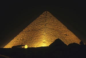 The Pyramid of Cheops illuminated at night The Pyramid of Cheops illuminated at night