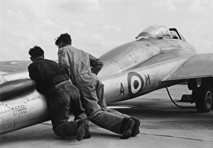 RAF De Havilland Vampire being pushed into position ready for take-off RAF De Havilland Vampire being pushed into position ready for take-off