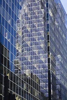Reflections in a modern glass and steel office tower building, Montreal, Quebec, Canada Reflections in a modern glass and steel office tower building, Montreal, Quebec, Canada