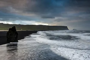 Reynisdrangar rock formation, dramatic clouds, black sand beach, near Vik i Myrdal, South Coast, Suourland, Iceland Reynisdrangar rock formation, dramatic clouds, black sand beach, near Vik i Myrdal, South Coast, Suourland, Iceland