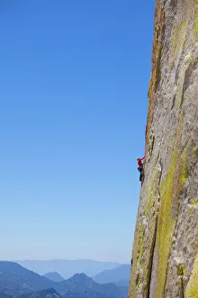 Photographers/tyler stableford photography/rock climber climbing steep face rock cliff Photographers/tyler stableford photography/rock climber climbing steep face rock cliff