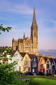 Row of colorful houses with cathedral background in Cobh, County Cork, Ireland Row of colorful houses with cathedral background in Cobh, County Cork, Ireland