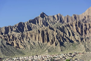 Rugged mountain and a planned settlement, social housing, Tilcara, Jujuy Province, Argentina Rugged mountain and a planned settlement, social housing, Tilcara, Jujuy Province, Argentina