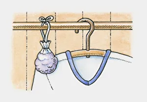 Sachet of lavender hanging on clothes rail in wardrobe, next to a shirt Sachet of lavender hanging on clothes rail in wardrobe, next to a shirt