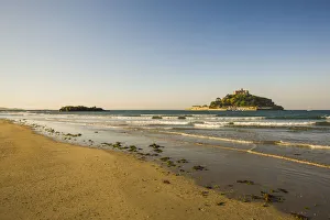 Sand beach with the island of St. Michaels Mount at high tide, Marazion, Cornwall, England, United Kingdom Sand beach with the island of St. Michaels Mount at high tide, Marazion, Cornwall, England, United Kingdom