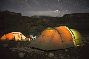 Scenic view of tents under starry sky from Moir Huts Camp, alpine zone, Mount Kilimanjaro Scenic view of tents under starry sky from Moir Huts Camp, alpine zone, Mount Kilimanjaro
