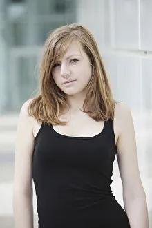 Sensual portrait of a young long-haired woman in a black tank top Sensual portrait of a young long-haired woman in a black tank top