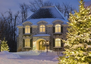 Snow covered cottage at dusk, Quebec, Canada Snow covered cottage at dusk, Quebec, Canada