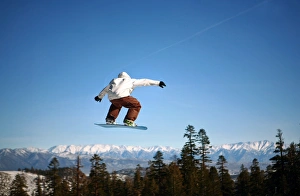 Snowboarder jumping at Mammoth Mountain Resort Snowboarder jumping at Mammoth Mountain Resort