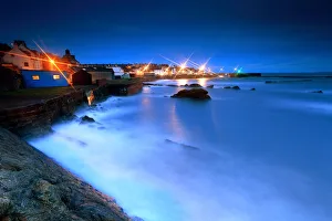 St Monans harbour lights at storm sea in night St Monans harbour lights at storm sea in night