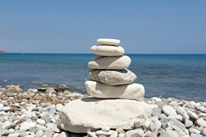 Stacked stones, cairn on the beach, gravel beach, Pissouri Beach, Cape Aspro, eastern Mediterranean sea, Cyprus, Europe Stacked stones, cairn on the beach, gravel beach, Pissouri Beach, Cape Aspro, eastern Mediterranean sea, Cyprus, Europe