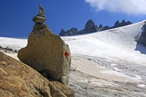 Steinmaennl, cairn made of stacked stones as a signpost on the edge of Orny Glacier in Steinmaennl, cairn made of stacked stones as a signpost on the edge of Orny Glacier in
