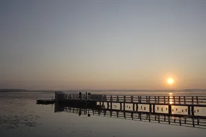 Sunrise at Federsee lake, Federsee Lake Pier, nature reserve near Bad Buchau Sunrise at Federsee lake, Federsee Lake Pier, nature reserve near Bad Buchau