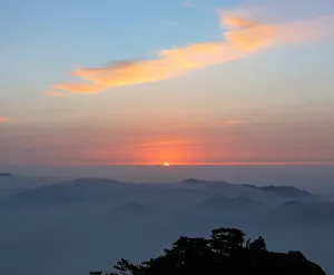 Sunrise above Mount Huangshan (Yellow Mountain or Mt. Huangshan), Anhui Province, China Sunrise above Mount Huangshan (Yellow Mountain or Mt. Huangshan), Anhui Province, China