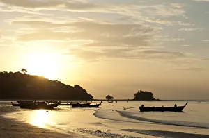 Sunset at the beach, fishing boats in silhouette, Nai Yang Beach, Phuket, Phuket Province, Thailand Sunset at the beach, fishing boats in silhouette, Nai Yang Beach, Phuket, Phuket Province, Thailand
