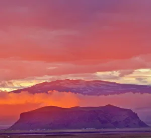 Sunset on the south coast, with Eyjafjallajoekull at the rear, Dyrholaey, Vik i Myrdal, Southern Region, Iceland Sunset on the south coast, with Eyjafjallajoekull at the rear, Dyrholaey, Vik i Myrdal, Southern Region, Iceland