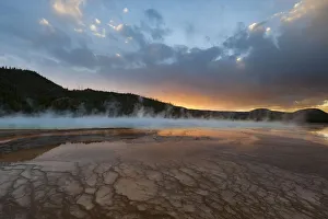 Sunset with steam rising from Grand Prismatic Spring, Yellowstone National Park, Wyoming, USA Sunset with steam rising from Grand Prismatic Spring, Yellowstone National Park, Wyoming, USA