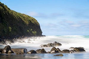 Surf washing over rocks on the beach, Opunake, Taranaki Region, New Zealand Surf washing over rocks on the beach, Opunake, Taranaki Region, New Zealand