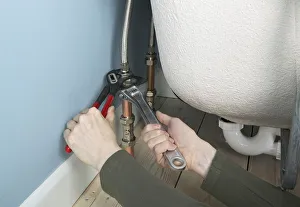 Collections/dorling kindersley prints/tightening flexible connectors attached bath Collections/dorling kindersley prints/tightening flexible connectors attached bath