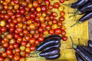 Tomatoes and eggplants for sale on market Tomatoes and eggplants for sale on market