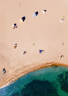 Top-down aerial view of sunbathers on a beach in Hanko, southern tip of Finland Top-down aerial view of sunbathers on a beach in Hanko, southern tip of Finland