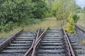 Tracks running into the countryside at a disused railway station on a regional route Tracks running into the countryside at a disused railway station on a regional route