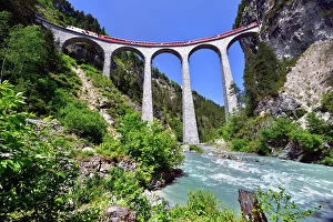 Rail Transportation Collection: A train of the Rhaetian Railway on the Landwasser Viaduct, UNESCO World Heritage Site