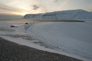 Trapper huts at Cape Schoulz at sunset on the partially frozen Tempelfjorden, Spitsbergen, Svalbard, Norway, Europe Trapper huts at Cape Schoulz at sunset on the partially frozen Tempelfjorden, Spitsbergen, Svalbard, Norway, Europe