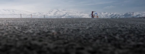 A truck driving at snow mountain landscape A truck driving at snow mountain landscape