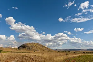 Vast arid landscape, blue sky with clouds, Isalo National Park near Ranohira, Madagascar Vast arid landscape, blue sky with clouds, Isalo National Park near Ranohira, Madagascar