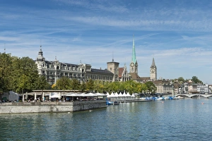 View from Quaibruecke bridge over the Limmat river, beer garden on the island auf Bauschaenzli View from Quaibruecke bridge over the Limmat river, beer garden on the island auf Bauschaenzli
