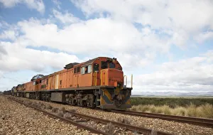 Side View of a Train on a Country Railway Track Side View of a Train on a Country Railway Track