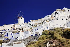 Windmill and white houses in Santorini, Greece Windmill and white houses in Santorini, Greece