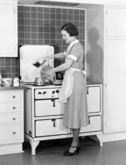 Woman In Cotton Dress & Maid Apron Standing Woman In Cotton Dress & Maid Apron Standing