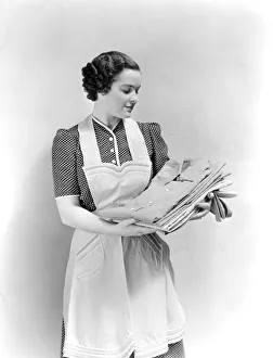 Woman Holding Clean Laundry Shirts Wearing Polka Dot Dress And Apron Pride Housewife Woman Holding Clean Laundry Shirts Wearing Polka Dot Dress And Apron Pride Housewife