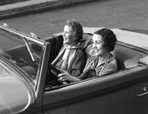 Women Both Are Laughing While The Driver'S Wearing A Wedding Band & Lace Shawl Women Both Are Laughing While The Driver'S Wearing A Wedding Band & Lace Shawl