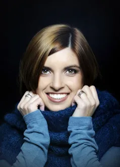 Young smiling woman wearing a turtleneck sweater, portrait Young smiling woman wearing a turtleneck sweater, portrait