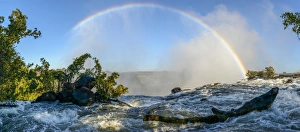 The Zambezi River and rainbow just above The Eastern Cataract. Victoria Falls The Zambezi River and rainbow just above The Eastern Cataract. Victoria Falls
