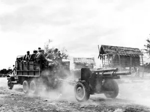 Bound for the Laos front Laotian government troops and their artillery weapon speed Bound for the Laos front Laotian government troops and their artillery weapon speed