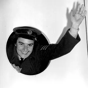 A cheery wave from Flight Sgt Sheila Eames, Womens Royal Air Force as she arrives A cheery wave from Flight Sgt Sheila Eames, Womens Royal Air Force as she arrives