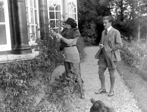 Constance, Duchess of Westminsterand Captain Lewis in the garden of her New Forest Constance, Duchess of Westminsterand Captain Lewis in the garden of her New Forest