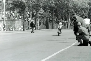 Isle Of Man: German motor cycle racder Ernst Degner riding a 50 c.c. Japanese Suzuki Isle Of Man: German motor cycle racder Ernst Degner riding a 50 c.c. Japanese Suzuki