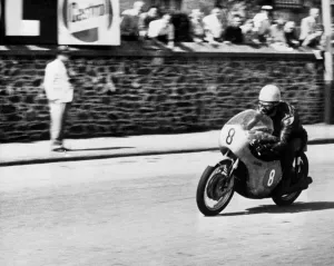 Isle of Man: Jim Redman pictured at speed on his new four-cylinder Honda during the Isle of Man: Jim Redman pictured at speed on his new four-cylinder Honda during the