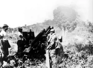 Laos: Royal laotian artillerymen fire a 105mm. Howitzer against a rebel position Laos: Royal laotian artillerymen fire a 105mm. Howitzer against a rebel position