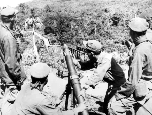 Laos: Royal Laotian soldiers ready for action with an 81mm mortar from a position Laos: Royal Laotian soldiers ready for action with an 81mm mortar from a position