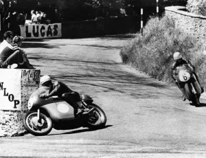 Mike Hailwood leads Rhodesias Gary Hocking as they go into the last lap in the Junior Mike Hailwood leads Rhodesias Gary Hocking as they go into the last lap in the Junior